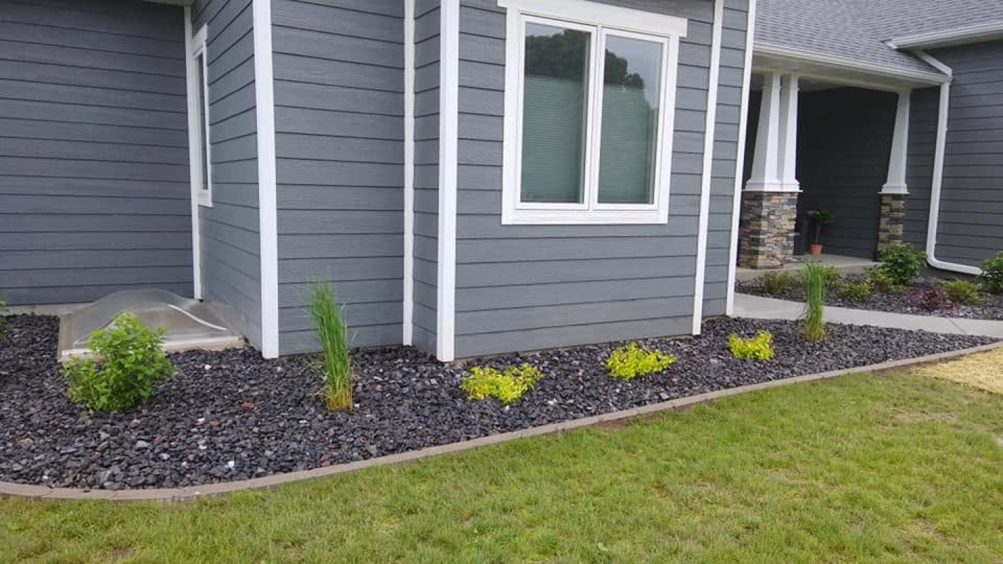 New lawn area with planting beds after Four Seasons installation, Platteville WI